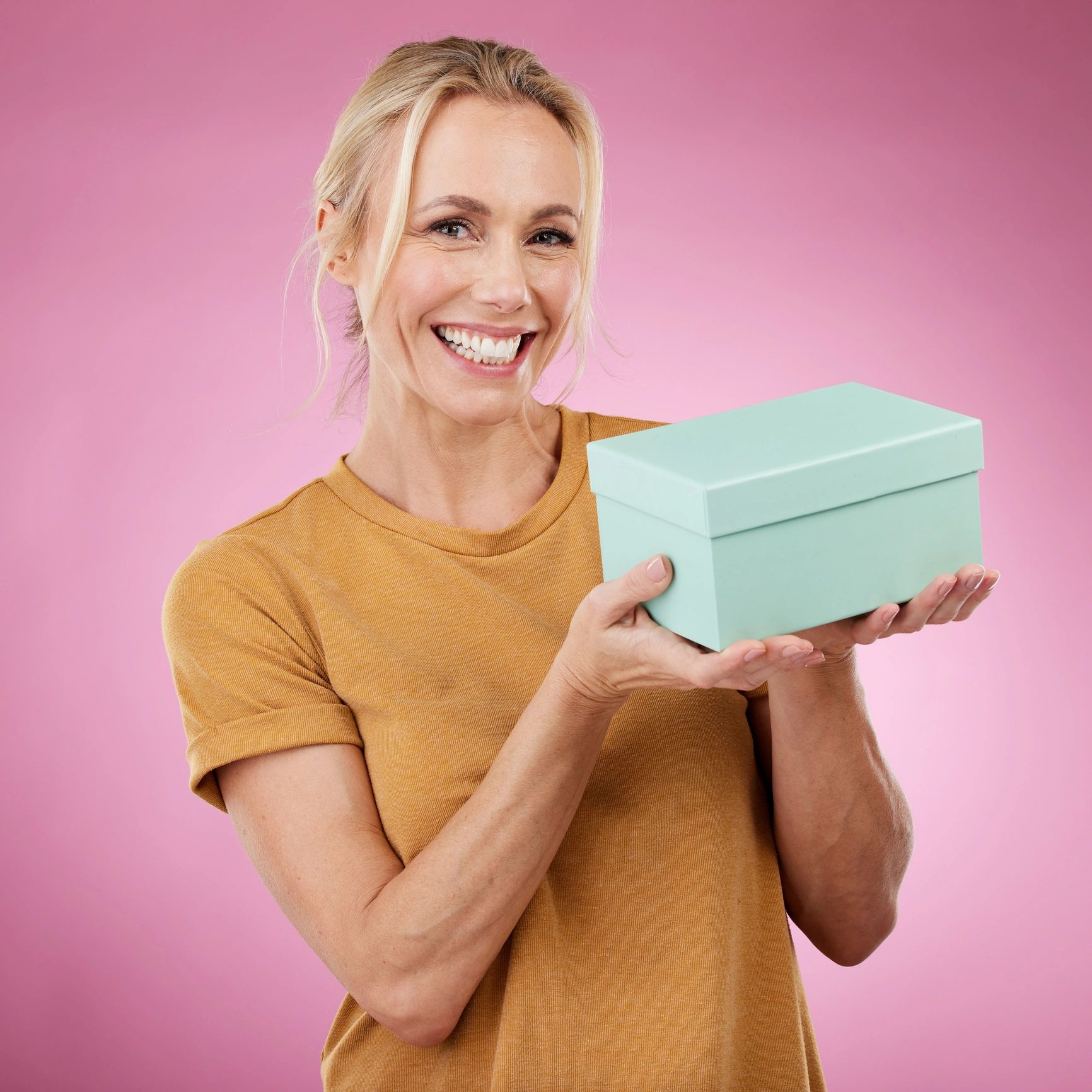 Happy customer holding a beautifully wrapped gift box