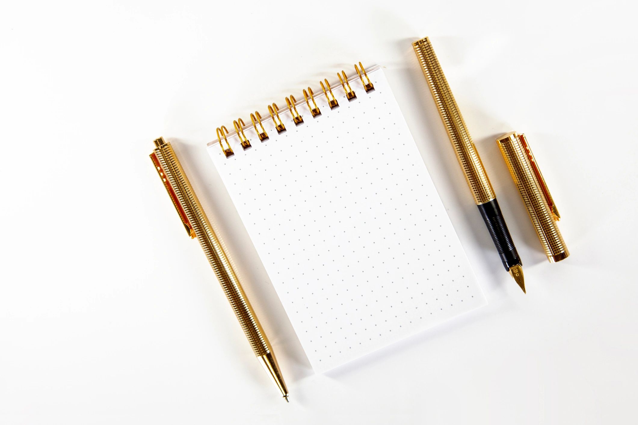 Luxury stationery with notebook and pens arranged beautifully