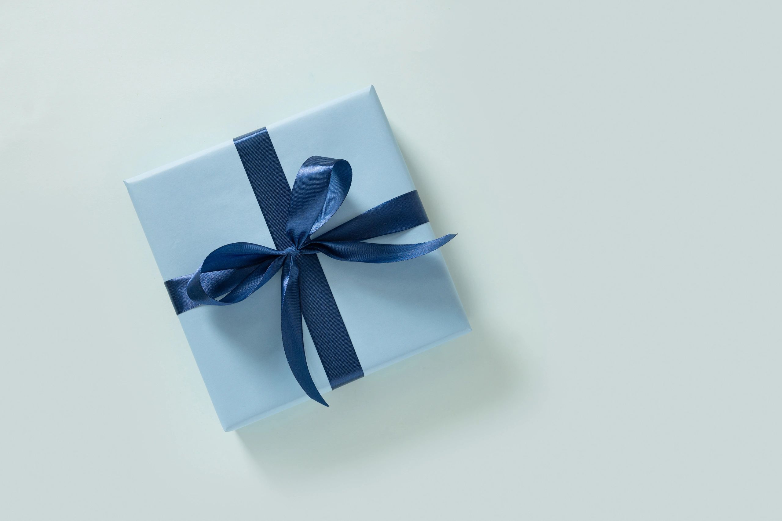 Elegant gift box with ribbon symbolizing the brand promise